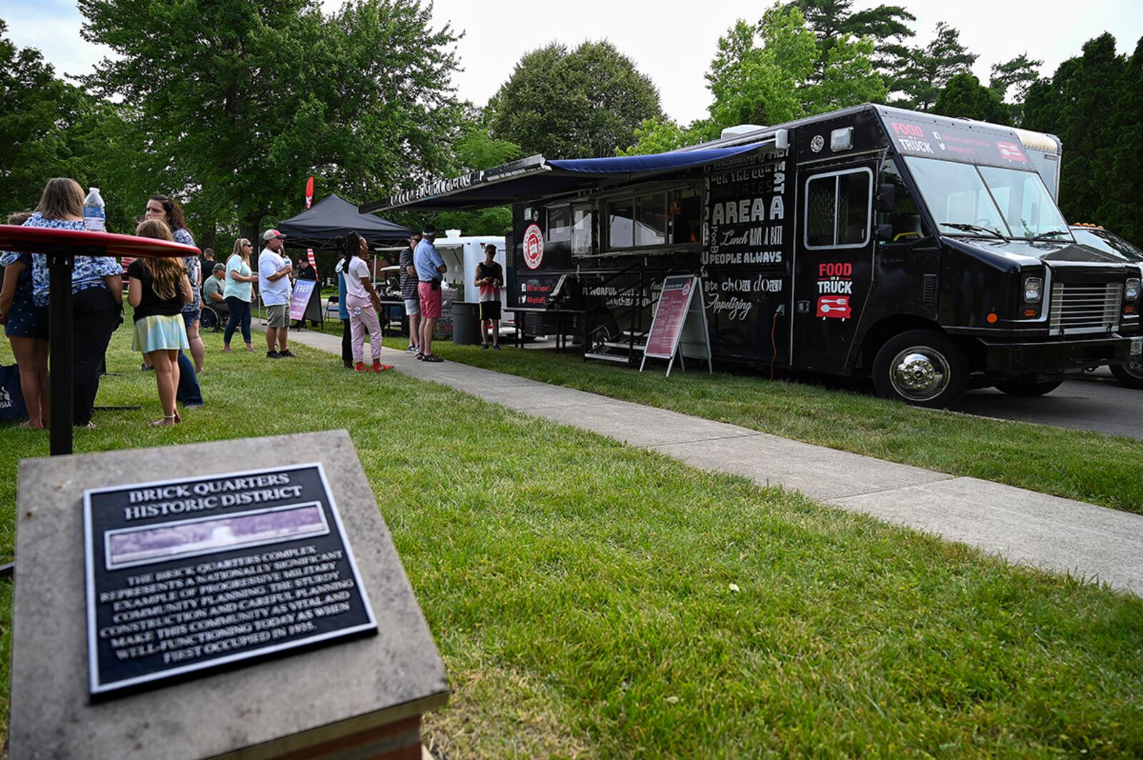 Partygoers check out Food on the Run, the 88th Force Support Squadron food truck, during the summer’s first Block Party Concert at Turtle Pond in the Brick Quarters historic district June 24 at Wright-Patterson Air Force Base. U.S. AIR FORCE PHOTO/R.J. ORIEZ