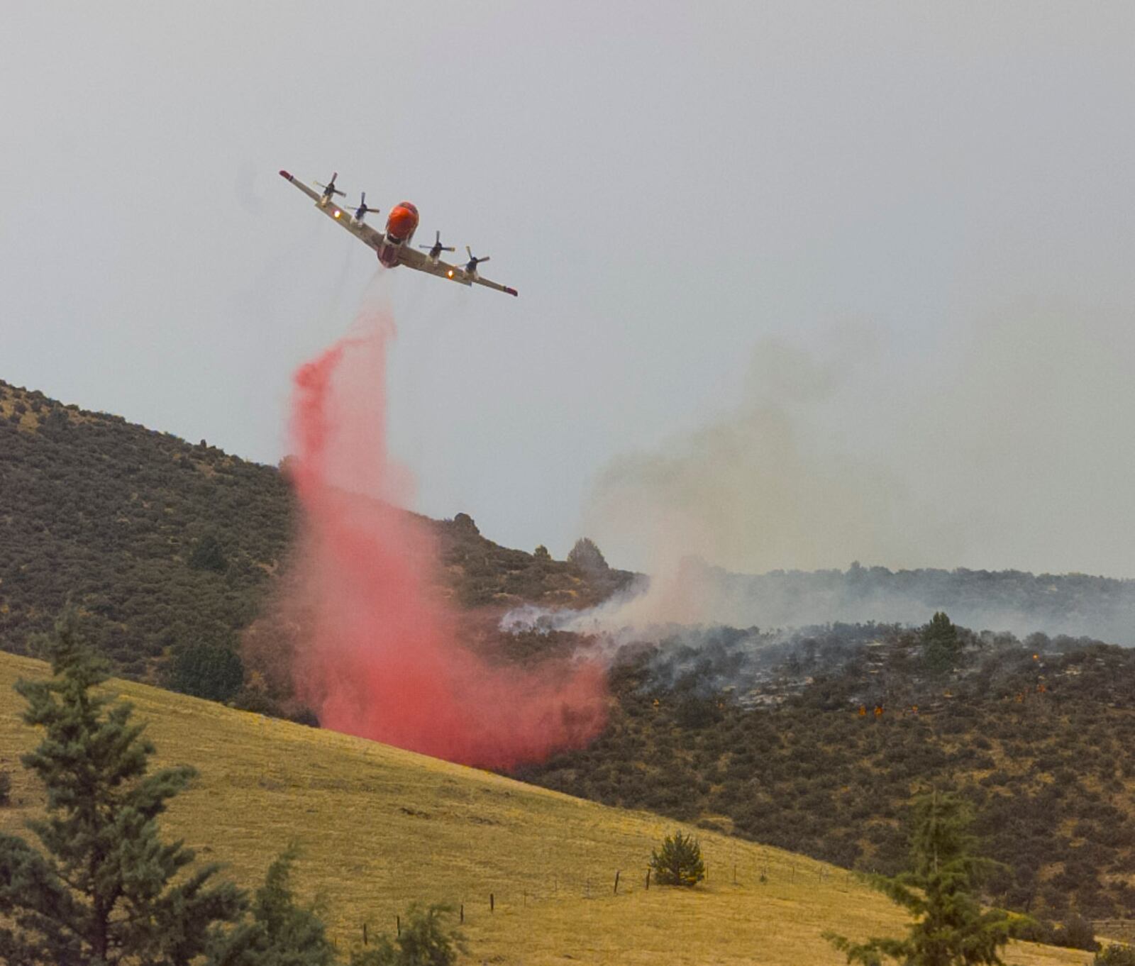Orion P-3 fire bomber does its work in Yreka, California, 1997.