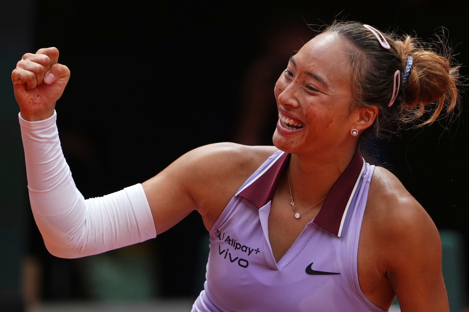 China's Zheng Qinwen celebrates beating Russia's Liudmila Samsonova during their fourth round match of the French Tennis Open, at the Roland-Garros stadium, in Paris, Sunday, June 1 2025. (AP Photo/Lindsey Wasson)