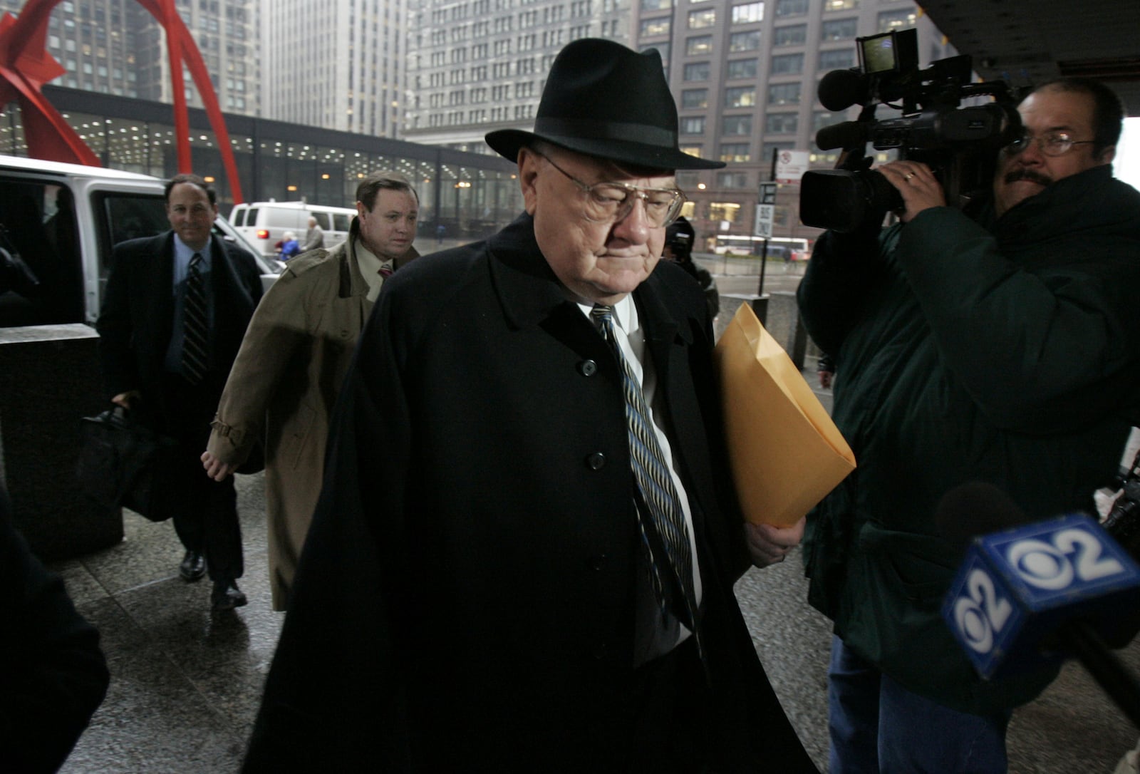 FILE - Former Gov. George Ryan arrives at federal court in Chicago for the first day of final arguments in his racketeering and corruption trial on Monday, March 6, 2006. (AP Photo/M. Spencer Green, File)