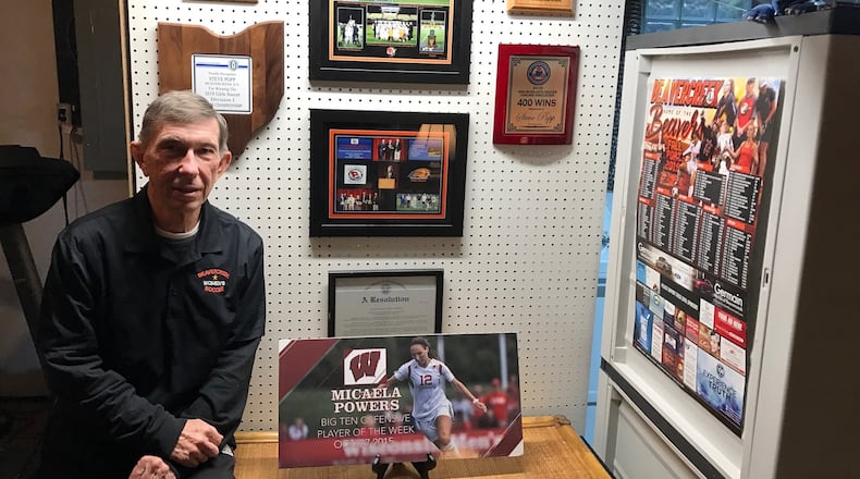 Steve Popp  with some of the memorabilia from his storied career coaching girls soccer. His biggest accomplishment though is coming back from a heart transplant on Jan. 4 and coaching his team to a 17-4 record and the regional semifinals. He was named the GWOC Coach of the Year. Tom Archdeacon/STAFF
