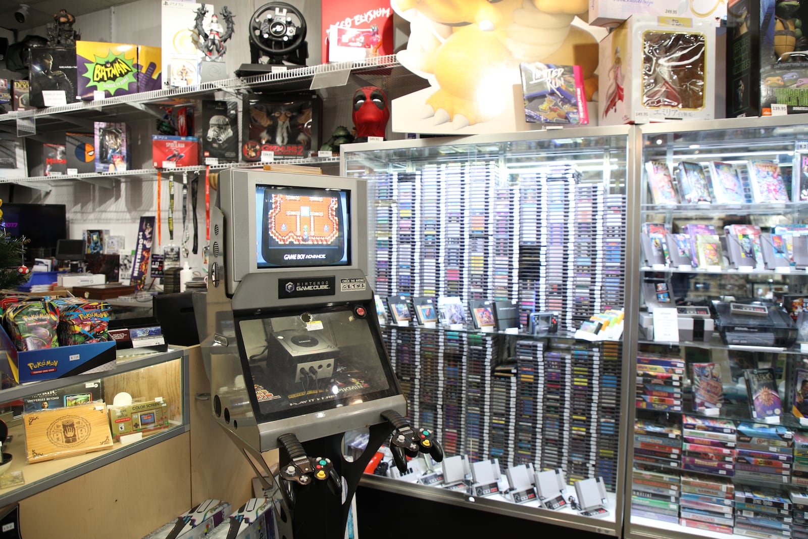 A GameCube kiosk next to the glass display of NES games and the front counter at Vacuums and Video Games. BRANDON BERRY/CONTRIBUTED