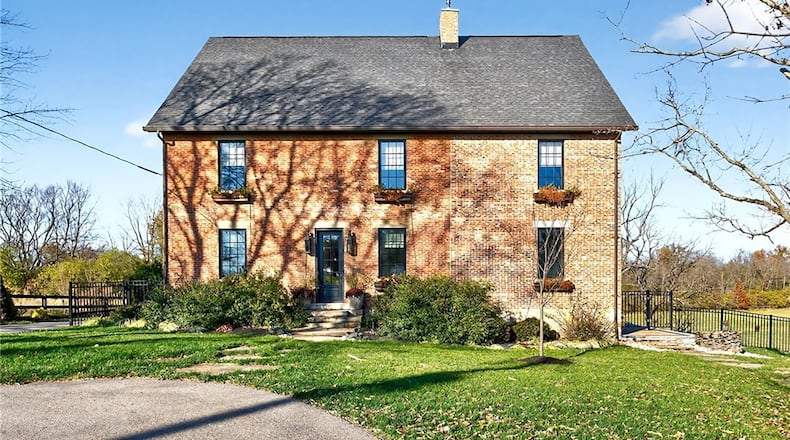 This 1830's era brick farmhouse sits on five acres and has been rebuilt and updated. CONTRIBUTED