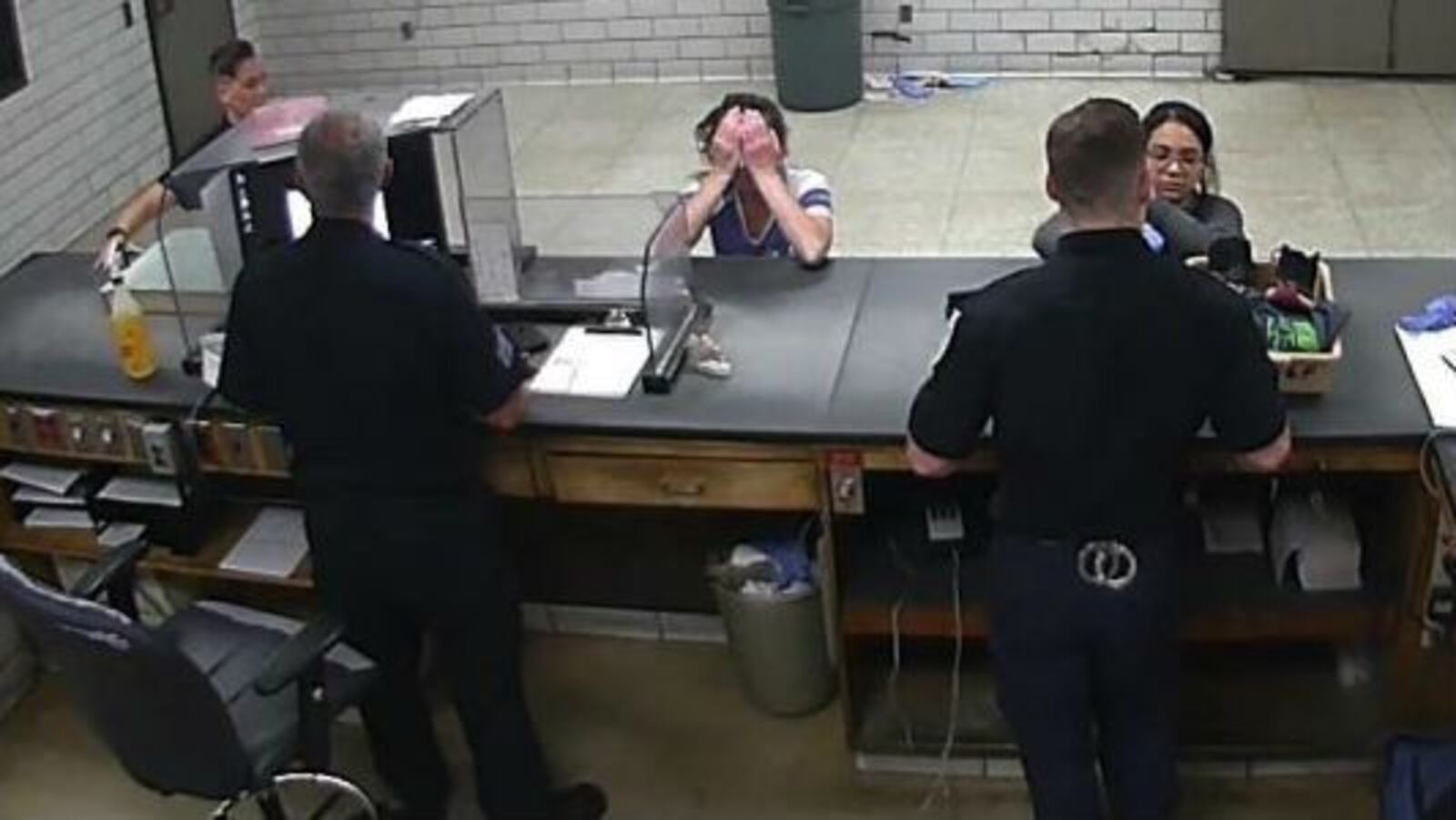 Madelyn Linsenmeir, 30, is visibly distraught as she is booked on an outstanding warrant Sept. 29, 2018, at the Springfield Police Department in Springfield, Mass. Linsenmeir died Oct. 4 of a heart infection.