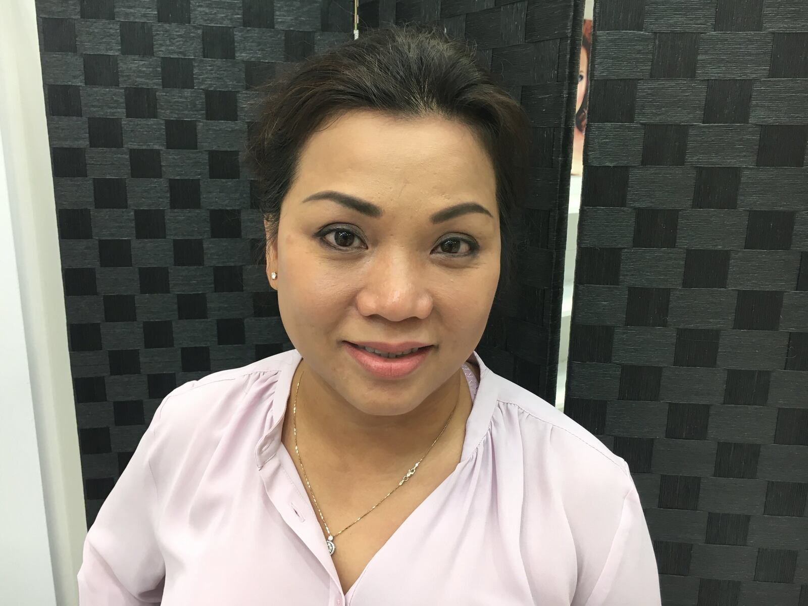 Nina Tran, co-owner of Phi Ink has permanent eyeliner, lip color and eyebrows. STAFF PHOTO / HOLLY SHIVELY