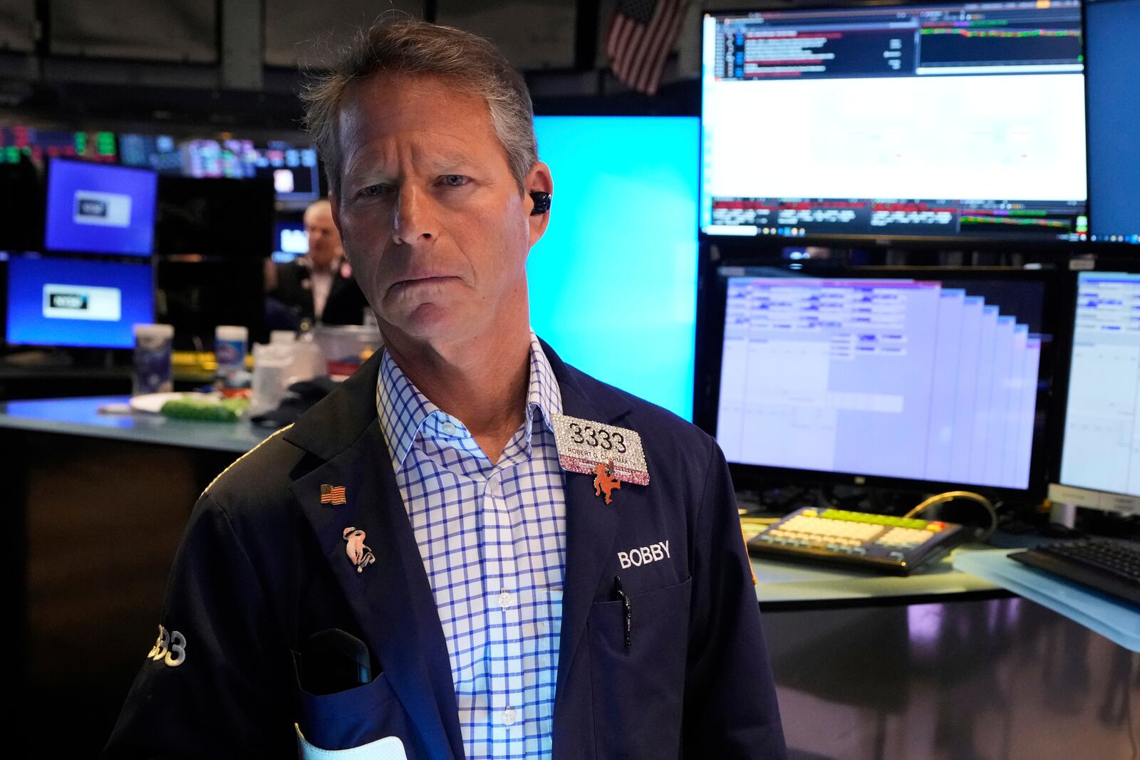 Trader Robert Charmak works on the floor of the New York Stock Exchange, Friday, April 4, 2025. (AP Photo/Richard Drew)