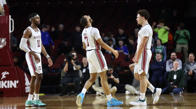 Massachusetts celebrates after a basket in the final minute against Dayton on Wednesday, Jan. 8, 2025, at the Mullins Center in Amherst, Mass. David Jablonski/Staff