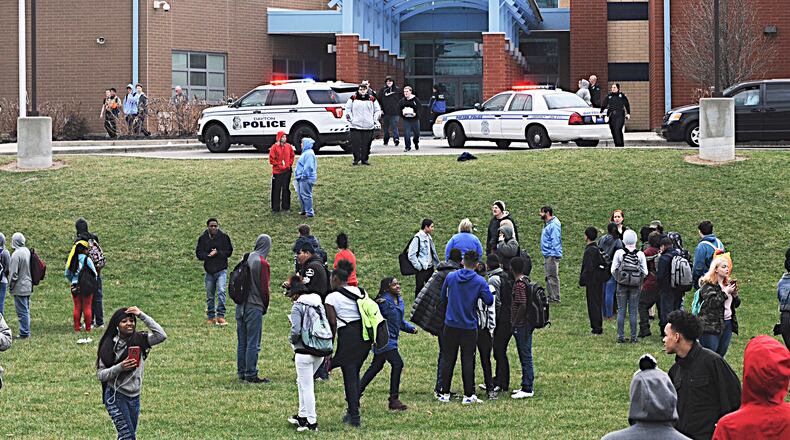 Belmont High School students evacuate the building in March after rumors circulated that a student was inside with a gun. MARSHALL GORBY / STAFF