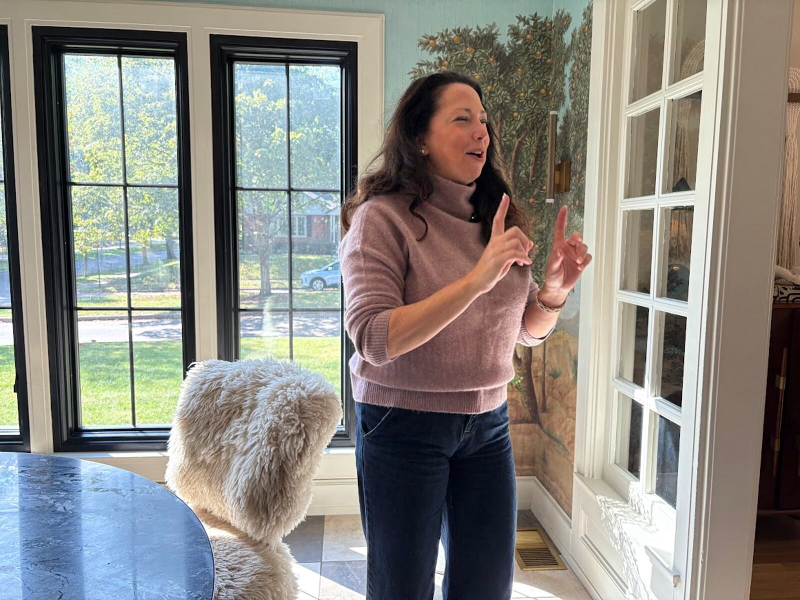 Katie Hill, founder and chief executive of Dayton-based real estate data site Unlisted, makes a point during an interview in an unlisted Oakwood home Monday, Sept. 29, 2025. THOMAS GNAU/STAFF
