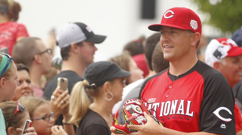 ESPN college football analyst Kirk Herbstreit arrives at batting practice for the All-Star Legends & Celebrity Softball Game on Sunday, July 12, 2015, at Great American Ball Park in Cincinnati. David Jablonski/Staff