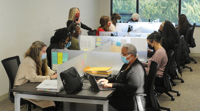 Employees of Homefull help Montgomery County applicants who are calling in to seek rental assistance. MARSHALL GORBY\STAFF