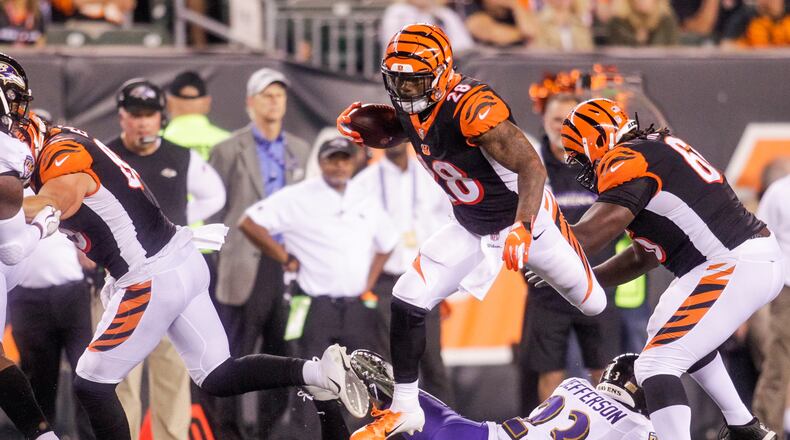 Cincinnati Bengals running back Joe Mixon carries the bll during their game against the Baltimore Ravens Thursday, Sept. 13 at Paul Brown Stadium in Cincinnati. The Cincinnati Bengals defeated the Baltimore Ravens 34-23. NICK GRAHAM/STAFF