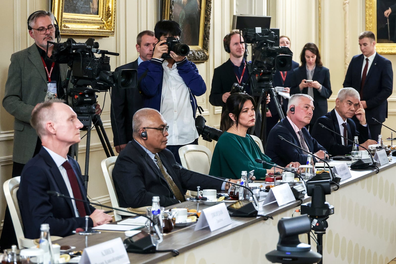 From left, The Associated Press News Director of Europe/Africa James Jordan, ANTARA News Director Akhmad Munir, BELTA Director General Iryna Akulovich, DPA Head of News Service Martin Romanczyk and Uzbekistan National News Agency Director General Abdusaid Kuchimov attend a meeting of Russian President Vladimir Putin with the heads of international news agencies at the newly renovated St. Petersburg Rimsky-Korsakov State Conservatory on the sidelines of the St. Petersburg International Economic Forum in St. Petersburg, Russia, Thursday, June 19, 2025. (Alexander Demyanchuk, Sputnik, Kremlin Pool Photo via AP)