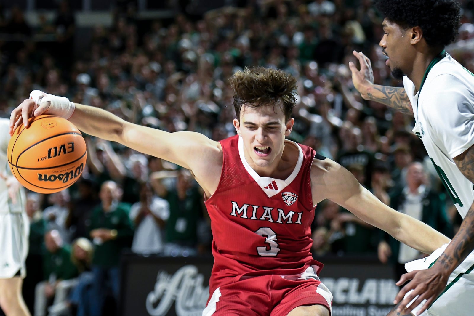 Miami guard Luke Skaljac drives to the basket during overtime of an NCAA college basketball game against Ohio, Friday, March 6, 2026, in Athens, Ohio. (AP Photo/HG Biggs)