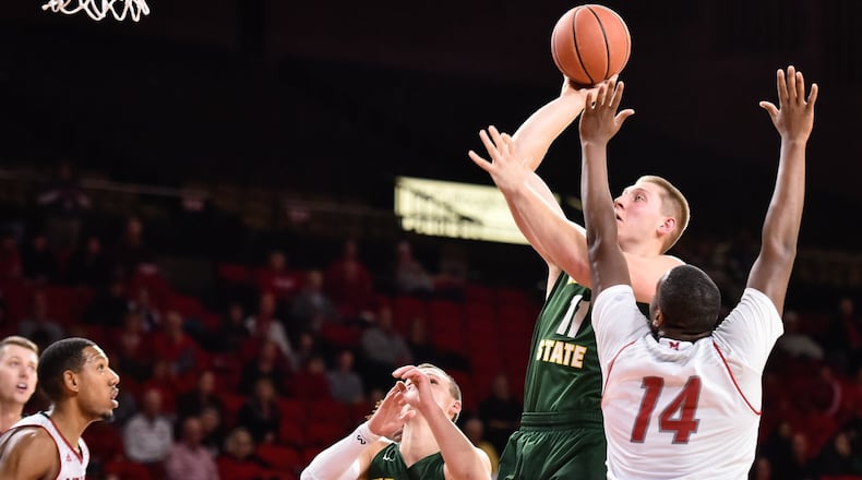 Wright State’s Loudon Love puts up a shot over Miami’s Bam Bowman during their game Tuesday, Nov. 14, 2017, at Millett Hall on the Miami University Campus in Oxford. The Miami University Redhawks basketball team defeated the Wright State Raiders 73-67 in overtime. NICK GRAHAM/STAFF