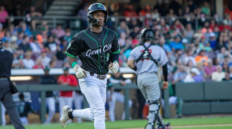 Dragons center fielder Carlos Jorge jogs to first base after being hit by a pitch in the third inning Saturday night at Day Air Ballpark. In a five-run seventh, Jorge hit a two-run single to give the Dragons the lead. Jeff Gilbert/CONTRIBUTED