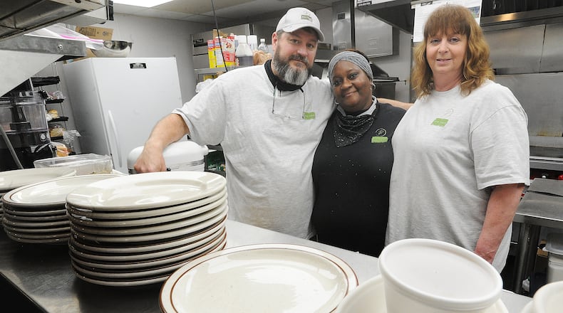 Chef Tom Tiner (left), owner of the newly opened Rye Toast Diner in Miamisburg, is shown with with the restaurant's cook, Delonda Slocum, and his wife, Connie. MARSHALL GORBY\STAFF