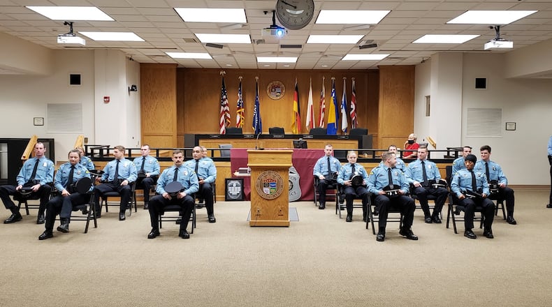 A photo posted to the Dayton Police Department's Twitter account, is captioned, "Getting ready to graduate! The 16 members of the 110th #DaytonPolice Recruit Class will be sworn in as officers this morning. Congrats to all!"