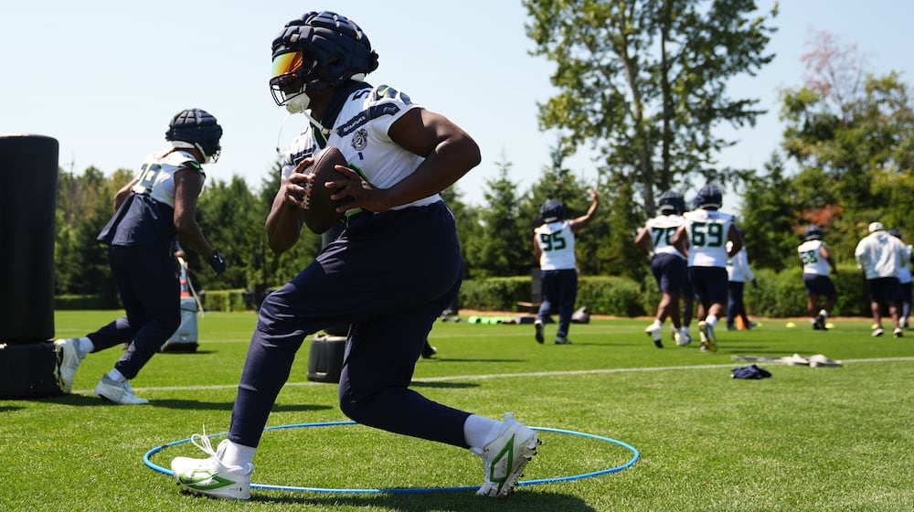 Seattle Seahawks linebacker Boye Mafe runs a drill during the NFL football team's training camp in Renton, Wash. (AP Photo/Lindsey Wasson)