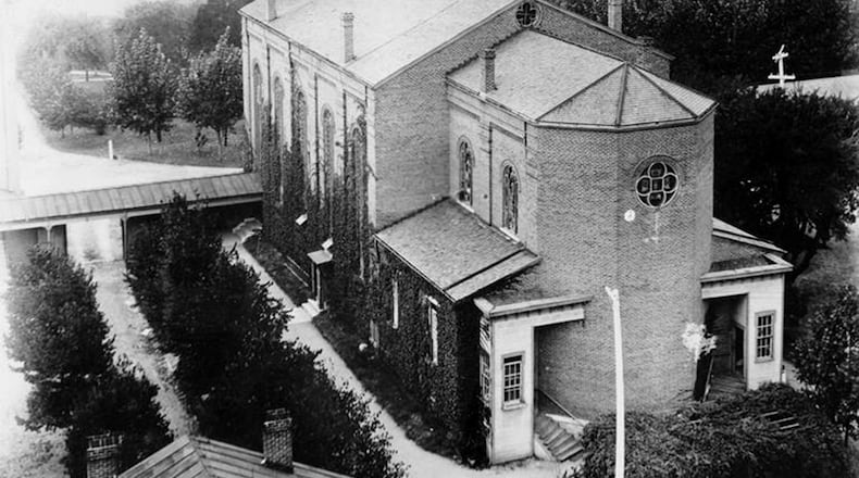 1900: The description from this photograph from the University Archives Collection reads, "In the center of the photograph is the Immaculate Conception Chapel as viewed from the east side of the building in 1900. Residential areas of Dayton, Ohio are visible in the upper right corner. Written on reverse, "1900--Rear view of Chapel--Nazareth, Saint Mary's Convent, Dayton, Ohio." Construction of Immaculate Conception Chapel was completed in 1869. The cupola was placed over the belfry in 1868 and capped with an 8 ft. cross. The four smaller crosses on each corner of the belfry were gilded in gold and were removed in 1907. PHOTO COURTESTY OF UNIVERSITY OF DAYTON. To view more photos and history about the University of Dayton's Chapel of the Immaculate Conception go to History Extra in the Sept. 9 e-edition of the Dayton Daily News.