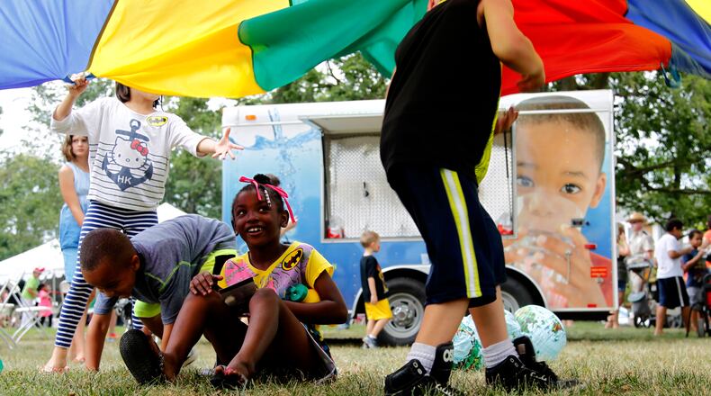 The Dayton Metro Library's Summer Party was held Saturday in downtown Dayton. Three thousand people attended the free family festival which provided a variety of games, live book characters, wandering performers and music. LISA POWELL/ STAFF PHOTO