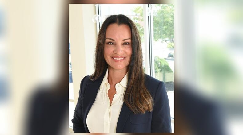 Tiffany Kellner, senior vice president of wealth management and a financial adviser with UBS Financial Services, is part of a team that teaches a continuing education class on financial strategies for retirement at the University of Dayton. CONTRIBUTED