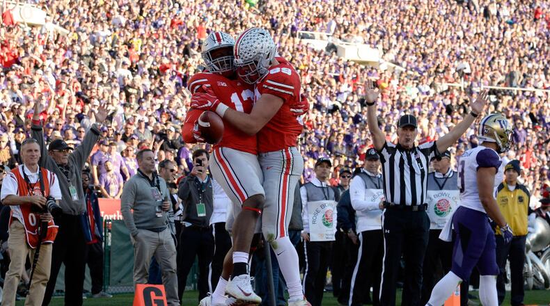PASADENA, CA - JANUARY 01: Rashod Berry #13 of the Ohio State Buckeyes and Luke Farrell #89 of the Ohio State Buckeyes celebrate after a touchdown during the first half in the Rose Bowl Game presented by Northwestern Mutual at the Rose Bowl on January 1, 2019 in Pasadena, California. (Photo by Kevork Djansezian/Getty Images)