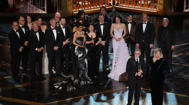 Paul Thomas Anderson, left center, Sara Murphy, right center, and the team from "One Battle After Another" accept the award for best picture during the Oscars on Sunday, March 15, 2026, at the Dolby Theatre in Los Angeles. (AP Photo/Chris Pizzello)