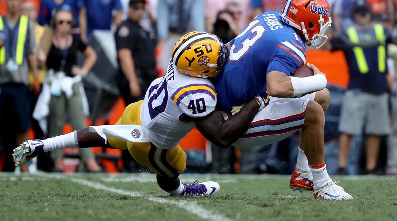 GAINESVILLE, FL - OCTOBER 07: Feleipe Franks #13 of the Florida Gators is sacked by Devin White #40 of the LSU Tigers during the game at Ben Hill Griffin Stadium on October 7, 2017 in Gainesville, Florida. (Photo by Sam Greenwood/Getty Images)
