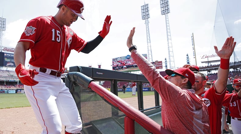 CINCINNATI, OH - MAY 06: Nick Senzel #15 of the Cincinnati Reds is greeted by manager David Bell after hitting a solo home run in the first inning against the San Francisco Giants at Great American Ball Park on May 6, 2019 in Cincinnati, Ohio. (Photo by Joe Robbins/Getty Images)