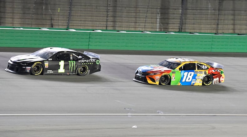 Kyle Busch (18) trails Kurt Busch (1) during the NASCAR Cup Series auto race at Kentucky Speedway in Sparta, Ky., Saturday, July 13, 2019. Kurt Busch won the race. (AP Photo/Timothy D. Easley)