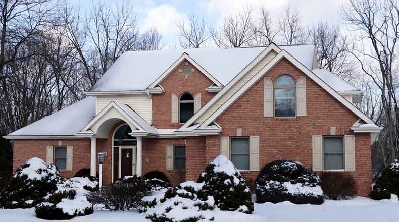 Tucked back off the road along a paved driveway and backyard neighbor to the golf course, the brick-and-frame house offers 4,650 sq. ft. of living space. The 3-story house features a turret and balcony that allows residents to take in the views of the 9.76-acre property. CONTRIBUTED PHOTO BY KATHY TYLER