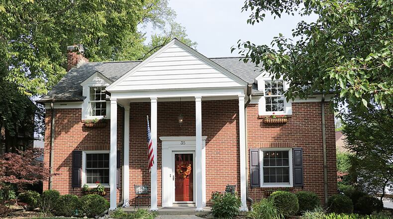 The 2-story home with 3 or 4 bedrooms has about 2,325 sq. ft. of living space plus a finished family room within the basement. Paver-bricks create walkways that flow into the driveway. CONTRIBUTED PHOTO BY KATHY TYLER
