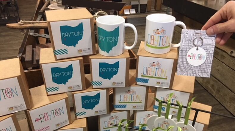 Dayton mugs, $13.50 Dayton ornaments, $11.50 A&O has three whimsical Dayton mugs to show your city pride while you sip on your coffee or tea. These make for great White Elephant gifts, stocking stuffers or pair it with a bag of local coffee as a larger gift. Contributed Photo by Alexis Larsen