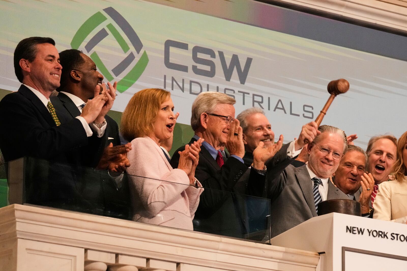 Joseph Armes, Chairman, President & CEO of CSW Industrials, gavels trading closed at the New York Stock Exchange, Monday, June 9, 2025. (AP Photo/Richard Drew)