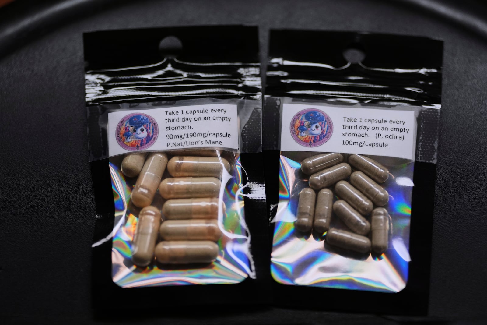 Capsules for microdosing psilocybin made by Marine Corps combat veteran Matt Metzger are pictured Wednesday, March 26, 2025, in Olympia, Wash. (AP Photo/Lindsey Wasson)