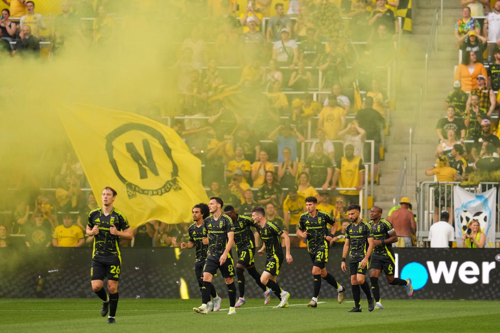 Columbus Crew forward Ibrahim Aliyu (11) celebrates with teammates after scoring during the first half of an MLS soccer match against Vancouver Whitecaps, Saturday, June 14, 2025, in Columbus, Ohio. (AP Photo/Jeff Dean)
