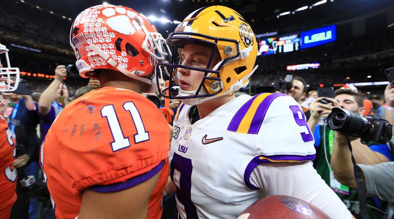 NEW ORLEANS, LOUISIANA - JANUARY 13: Joe Burrow #9 of the LSU Tigers congratulates Isaiah Simmons #11 of the Clemson Tigers after their 42-25 win in the College Football Playoff National Championship game at Mercedes Benz Superdome on January 13, 2020 in New Orleans, Louisiana. (Photo by Mike Ehrmann/Getty Images)