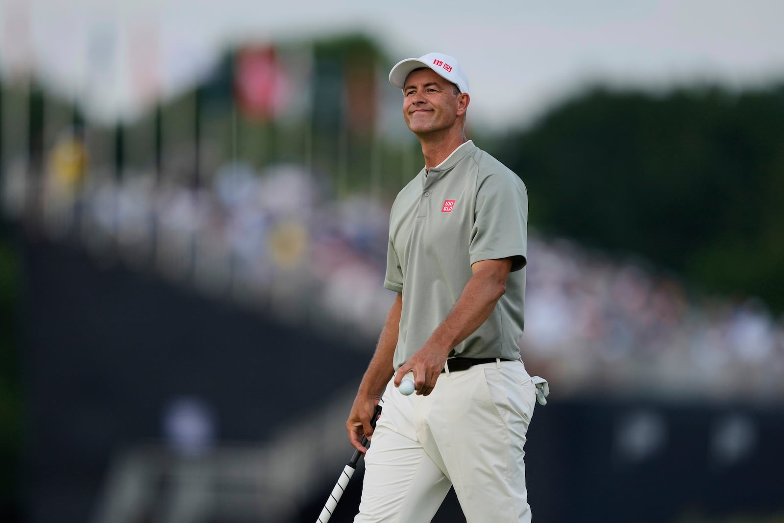 Adam Scott, of Australia, smiles after making a putt on the 16th hole during the third round of the U.S. Open golf tournament at Oakmont Country Club Saturday, June 14, 2025, in Oakmont, Pa. (AP Photo/Carolyn Kaster)