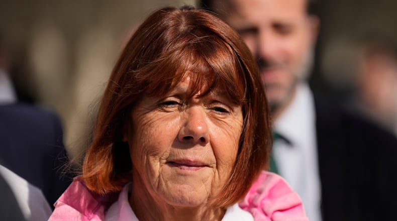 FILE - Gisele Pelicot leaves the courthouse for a break during the appeals trial in the case of a man challenging his conviction, less than a year after the landmark verdict in a drugging and rape trial that shook France, on Oct. 9, 2025 in Nimes, southern France. (AP Photo/Lewis Joly)