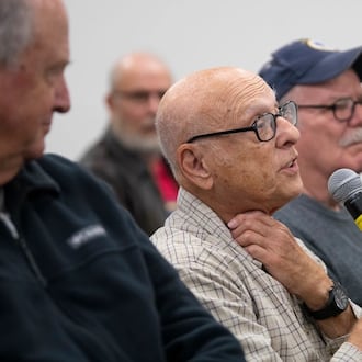 Lou Salerno, a military retiree, asks a question of David Hayes, prosecuting attorney for Greene County, Ohio, during Retiree Appreciation Day on Oct. 28, 2022, at Hope Hotel near Wright-Patterson Air Force Base. Air Force photo by R.J. Oriez.