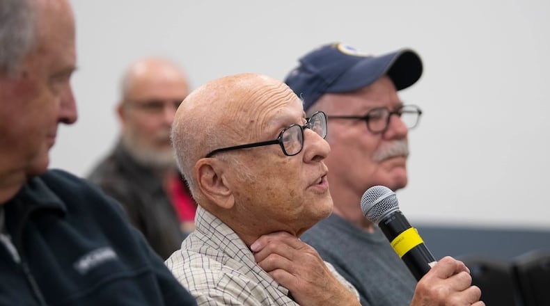 Lou Salerno, a military retiree, asks a question of David Hayes, prosecuting attorney for Greene County, Ohio, during Retiree Appreciation Day on Oct. 28, 2022, at Hope Hotel near Wright-Patterson Air Force Base. Air Force photo by R.J. Oriez.