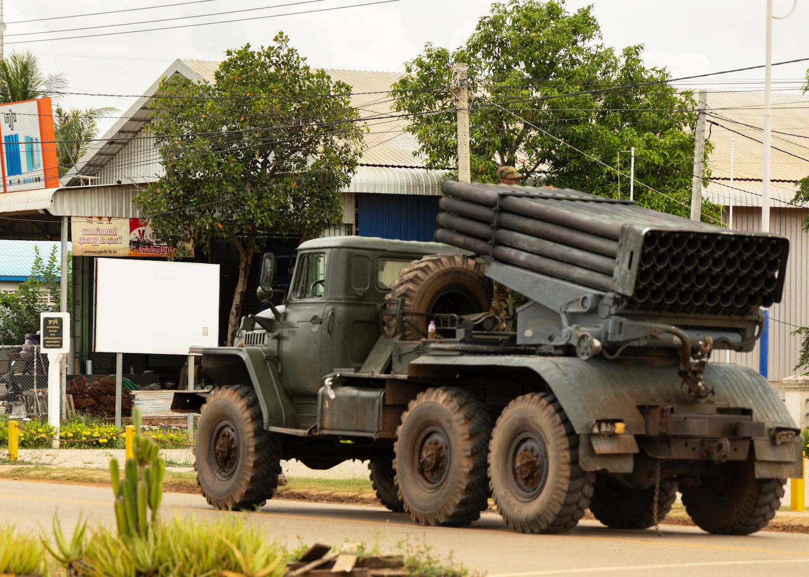Cambodian military vehicles drive away from the Cambodia-Thai border in Siem Reap on Monday, July 28, 2025. (AP Photo/Anton L. Delgado)
