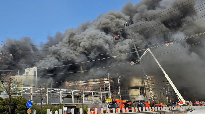 Black smoke rises from an auto parts plant in Daejeon, South Korea, Friday, March 20, 2026. (Kim So-yeon/Yonhap via AP)