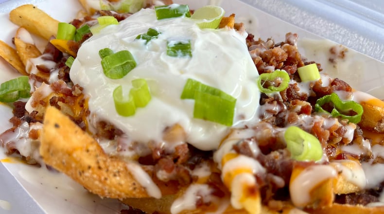 Just over a dozen food trucks on Saturday, Aug. 3, 2024 put their spin on what it means to have bacon at the forefront during Bacon Fest at the Fraze Pavilion in Kettering. NATALIE JONES/STAFF