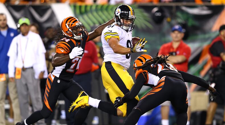 CINCINNATI, OH - SEPTEMBER 16: Tight end David Paulson #81 of the Pittsburgh Steelers runs after a catch before cornerback Adam Jones #24 of the Cincinnati Bengals strips the ball causing a fumble in the first quarter at Paul Brown Stadium on September 16, 2013 in Cincinnati, Ohio. (Photo by Andy Lyons/Getty Images)