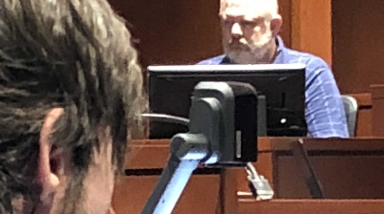 Christopher Kirby listens as Kevin Power, a relative, testified about the extended family living in the South Lebanon home where Kirby is alleged to have murdered his adoptive sister, Deborah Power. STAFF/LAWRENCE BUDD