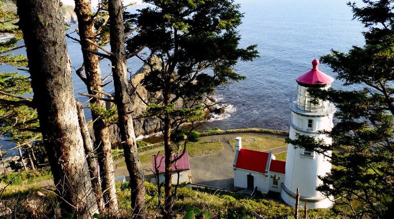 Hiking trails offer peekaboo views from above the Heceta Head Lighthouse. (Brian J. Cantwell/Seattle Times/TNS)