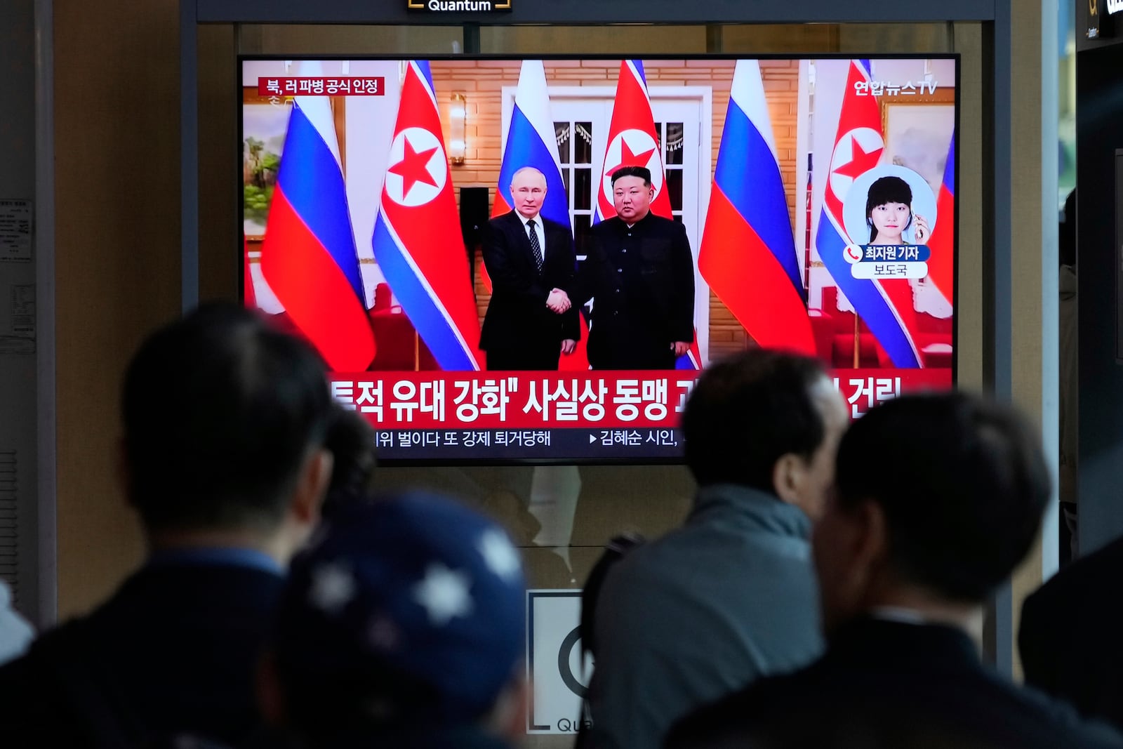 A TV screen shows a file image of North Korean leader Kim Jong Un, right, and Russian President Vladimir Putin in Pyongyang, during a news program at the Seoul Railway Station in Seoul, South Korea, Monday, April 28, 2025.(AP Photo/Ahn Young-joon)
