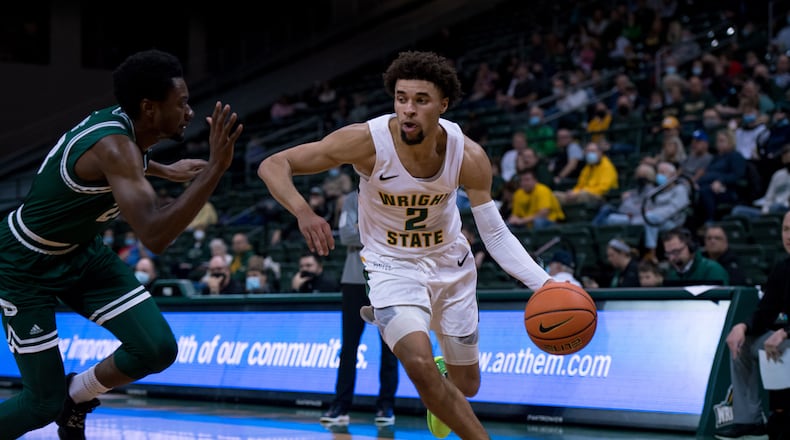 Wright State's Tanner Holden drives against a Green Bay player during a game at the Nutter Center on Jan. 1, 2022. Joseph Craven/Wright State Athletics